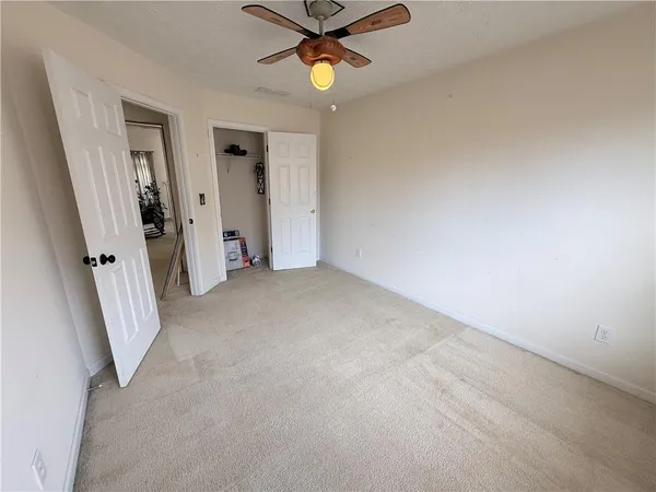 a view of an empty room with a window