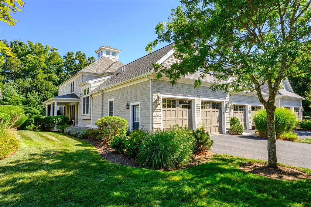 10 Backriver Road, Unit 10 Hingham, MA 02043 - Photo 1 of 31 a front view of a house with garden