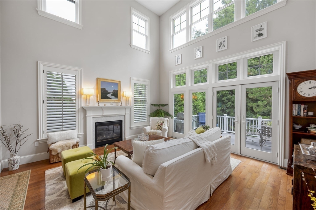 10 Backriver Road, Unit 10 Hingham, MA 02043 - Photo 11 of 31 a living room with furniture and a fireplace