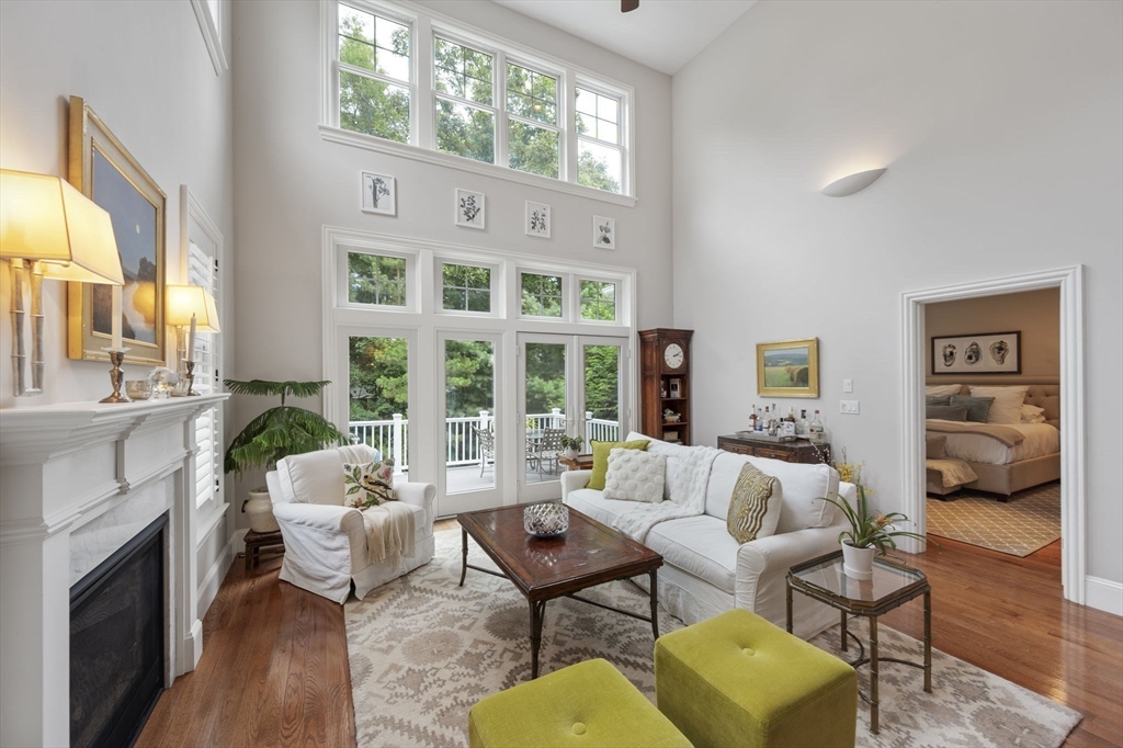 10 Backriver Road, Unit 10 Hingham, MA 02043 - Photo 12 of 31 a living room with furniture fireplace and a large window