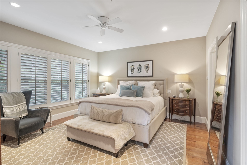 10 Backriver Road, Unit 10 Hingham, MA 02043 - Photo 13 of 31 a spacious bedroom with a bed a couch and a window