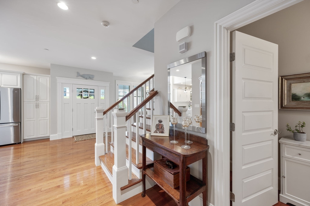 10 Backriver Road, Unit 10 Hingham, MA 02043 - Photo 17 of 31 a view of entryway and hall with wooden floor