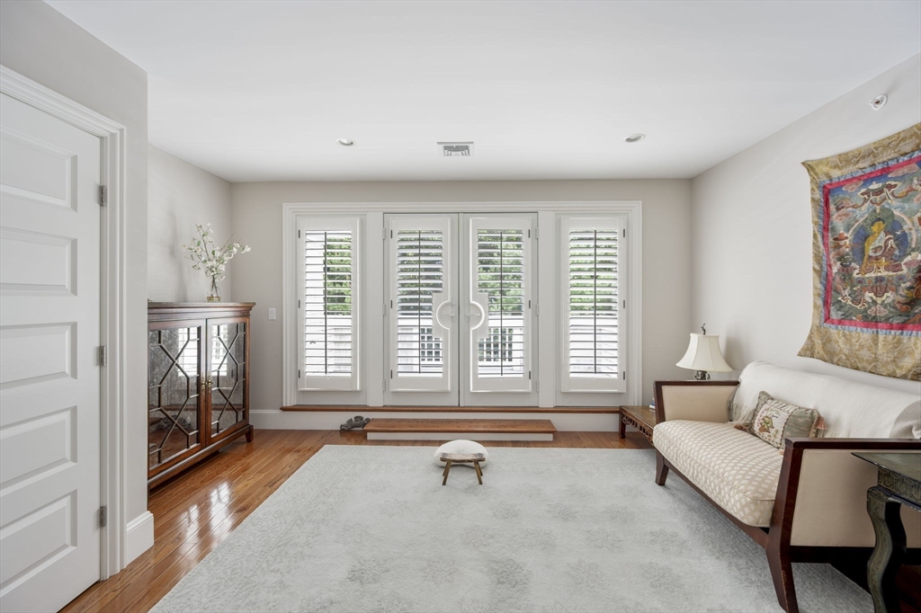 10 Backriver Road, Unit 10 Hingham, MA 02043 - Photo 18 of 31 a living room with furniture and floor to ceiling window