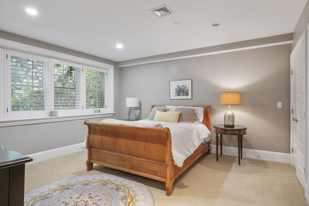 10 Backriver Road, Unit 10 Hingham, MA 02043 - Photo 22 of 31 a spacious bedroom with a bed and window