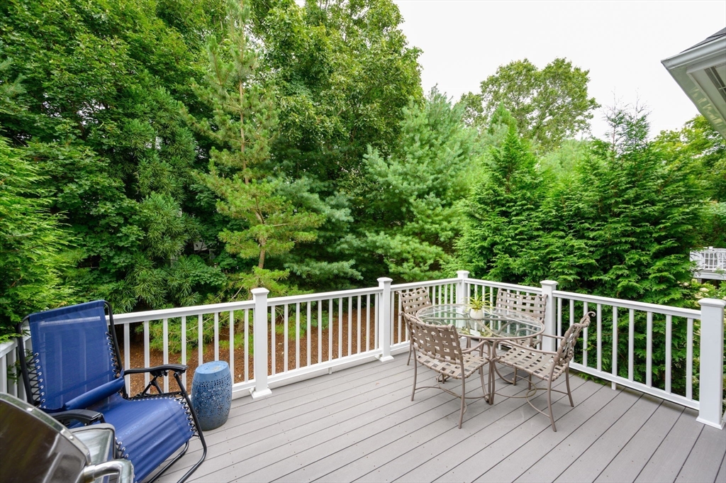 10 Backriver Road, Unit 10 Hingham, MA 02043 - Photo 28 of 31 a view of a chair and table on the deck
