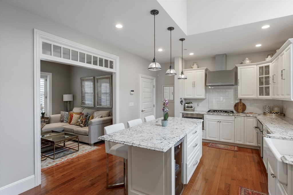 10 Backriver Road, Unit 10 Hingham, MA 02043 - Photo 6 of 31 a kitchen with a sink stove and refrigerator