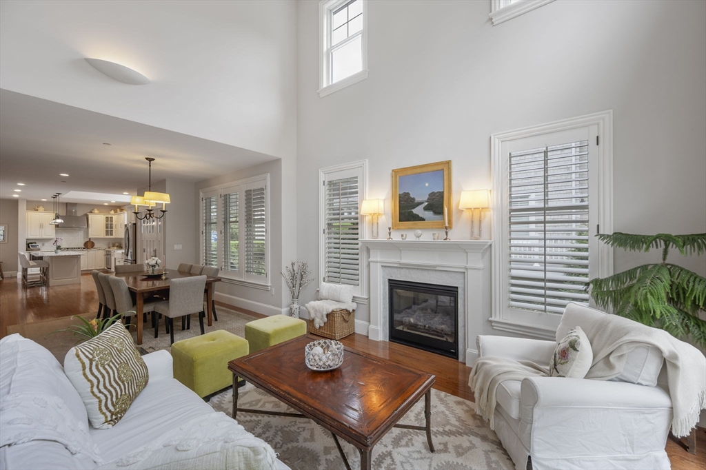 10 Backriver Road, Unit 10 Hingham, MA 02043 - Photo 10 of 31 a living room with furniture and a fireplace