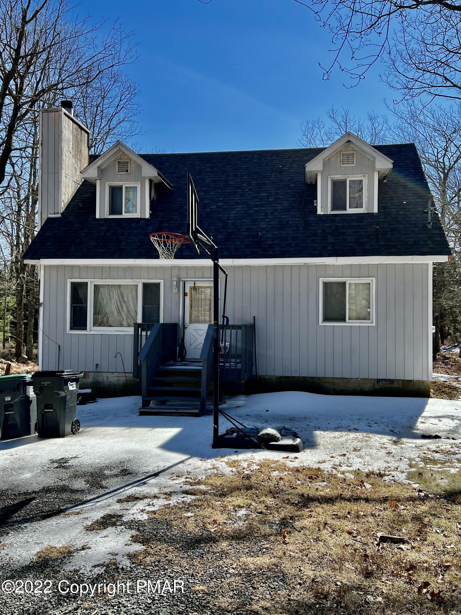152 Caribou Road Dingmans Ferry, PA 18328 - Photo 1 of 15 a front view of a house with a yard