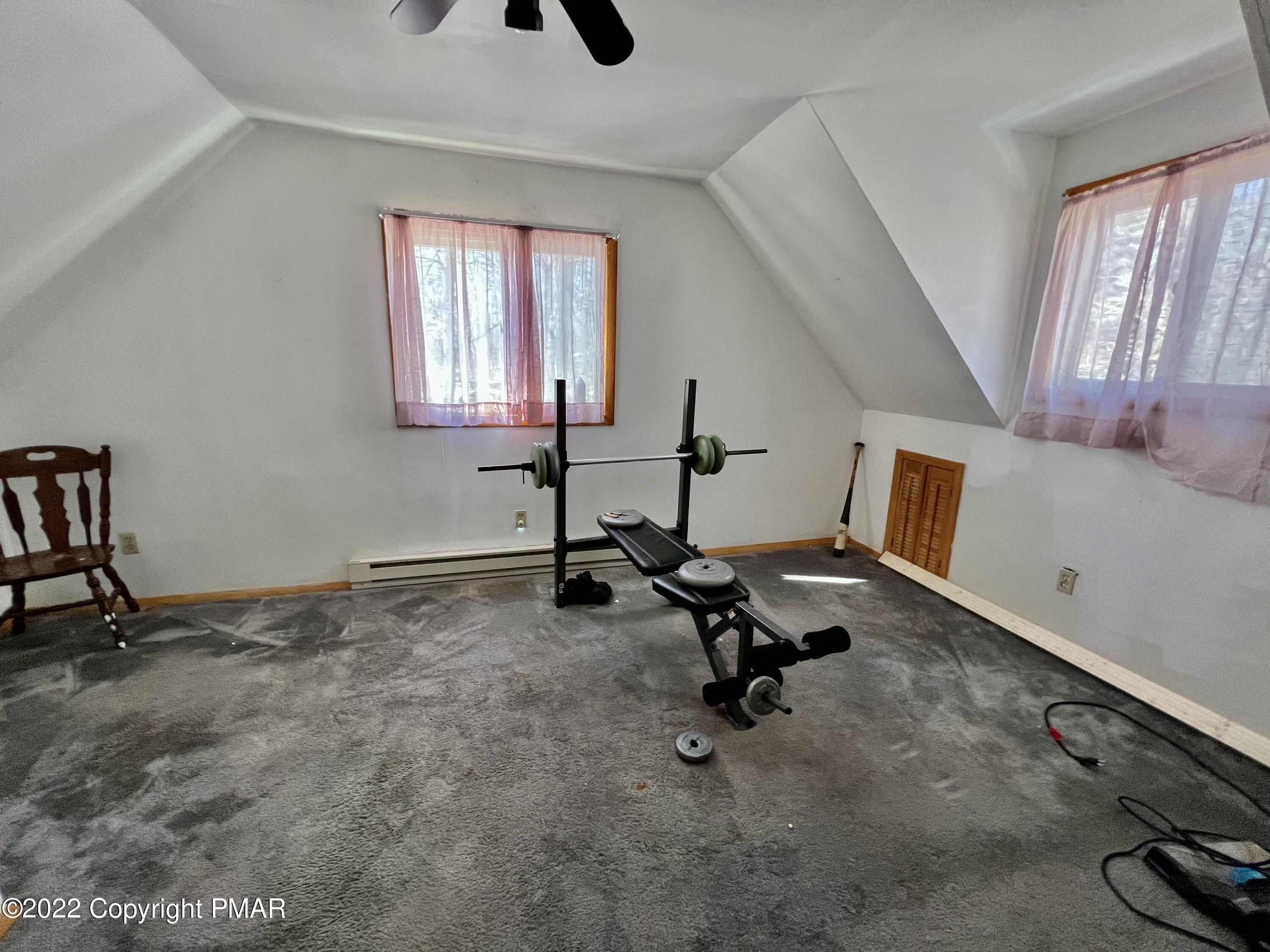 152 Caribou Road Dingmans Ferry, PA 18328 - Photo 11 of 15 a view of a room with gym equipment
