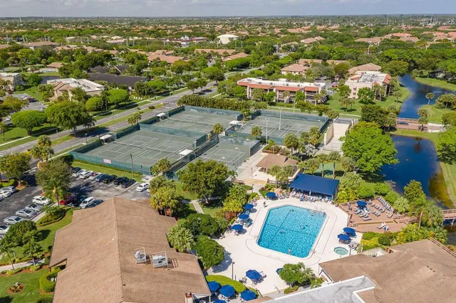 an aerial view of residential houses with outdoor space