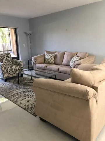 a living room with furniture and a couch