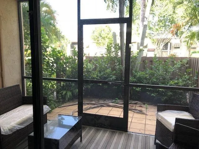 a view of a balcony with lake view and wooden floor