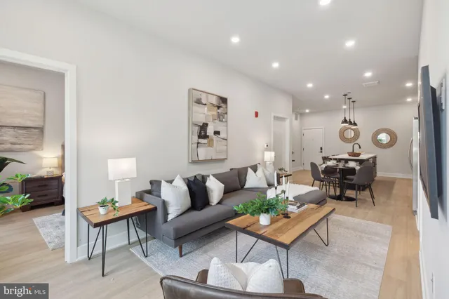 a living room with furniture and a table