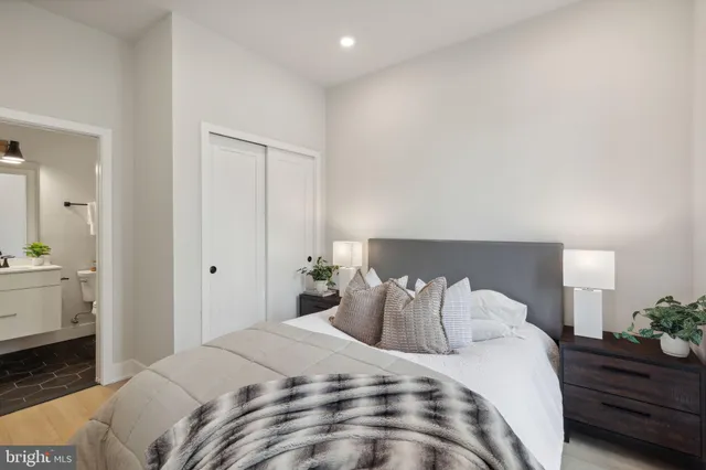 a bedroom with a bed and a closet