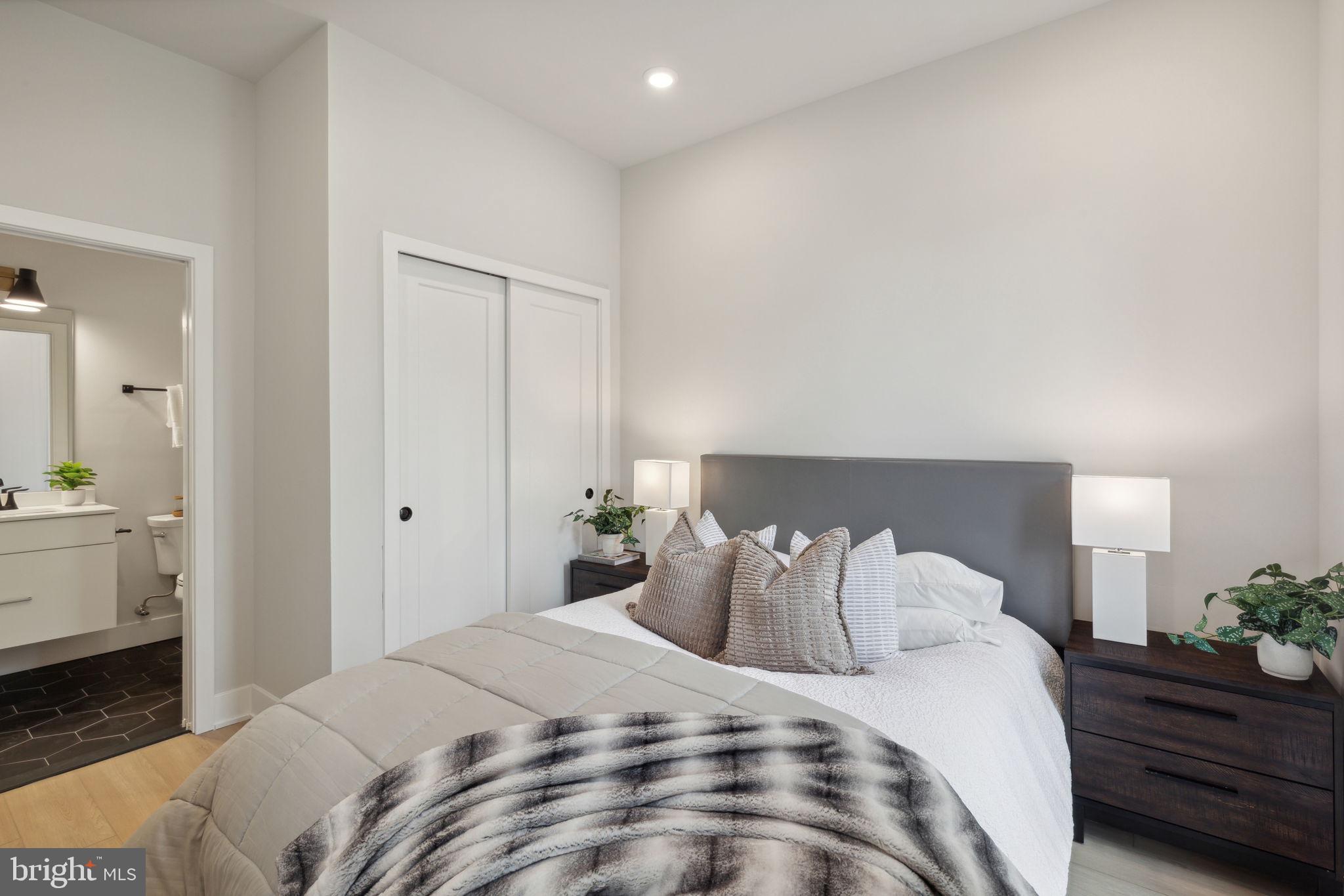 6910 Ridge Avenue, Unit 418 Philadelphia, PA 19128 - Photo 12 of 26 a bedroom with a bed and a closet