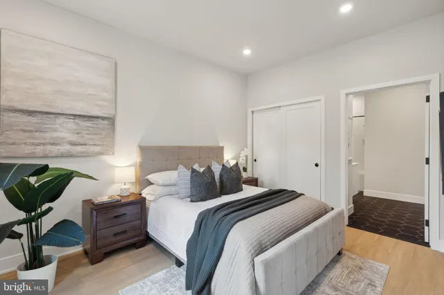 a bedroom with a bed and chair