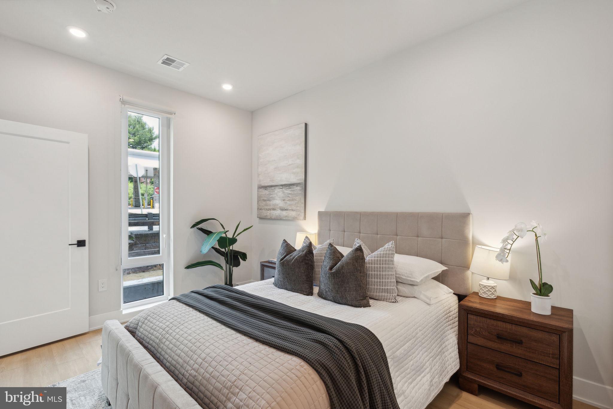 6910 Ridge Avenue, Unit 418 Philadelphia, PA 19128 - Photo 15 of 26 a bedroom with bed and a window