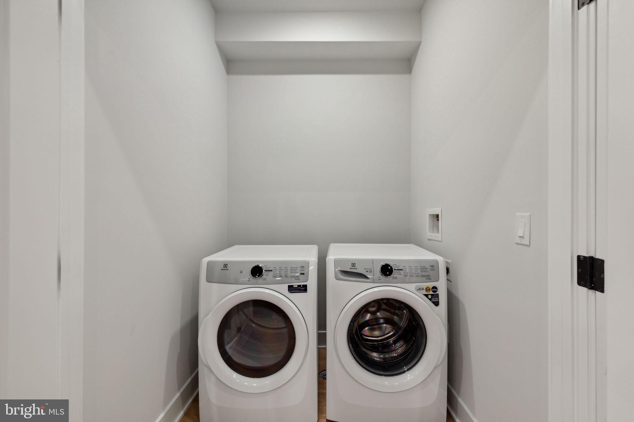 6910 Ridge Avenue, Unit 418 Philadelphia, PA 19128 - Photo 20 of 26 a utility room with dryer and washer