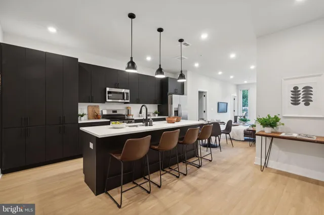 a kitchen with counter space cabinets a sink and appliances