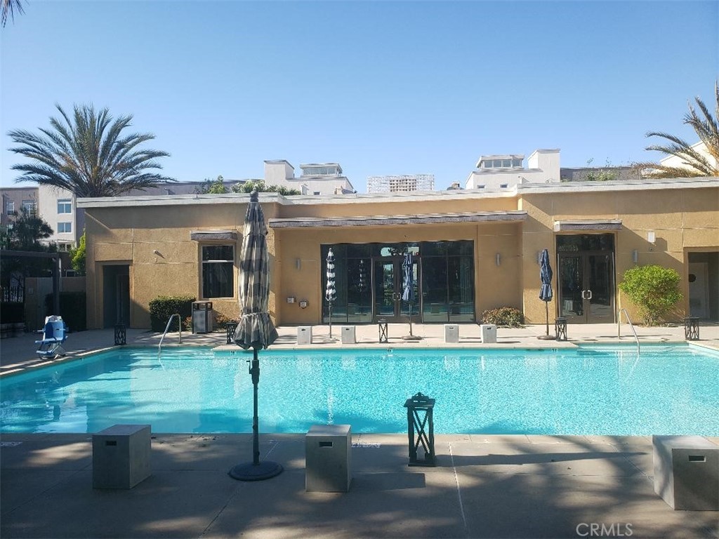 612 East Carson Street, Unit 202 Carson, CA 90745 - Photo 17 of 24 a view of a house with backyard porch and sitting area
