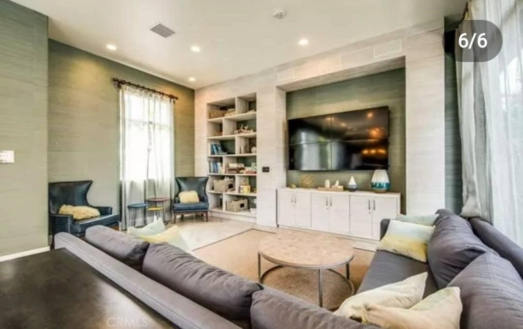 612 East Carson Street, Unit 202 Carson, CA 90745 - Photo 18 of 24 a living room with furniture and a flat screen tv
