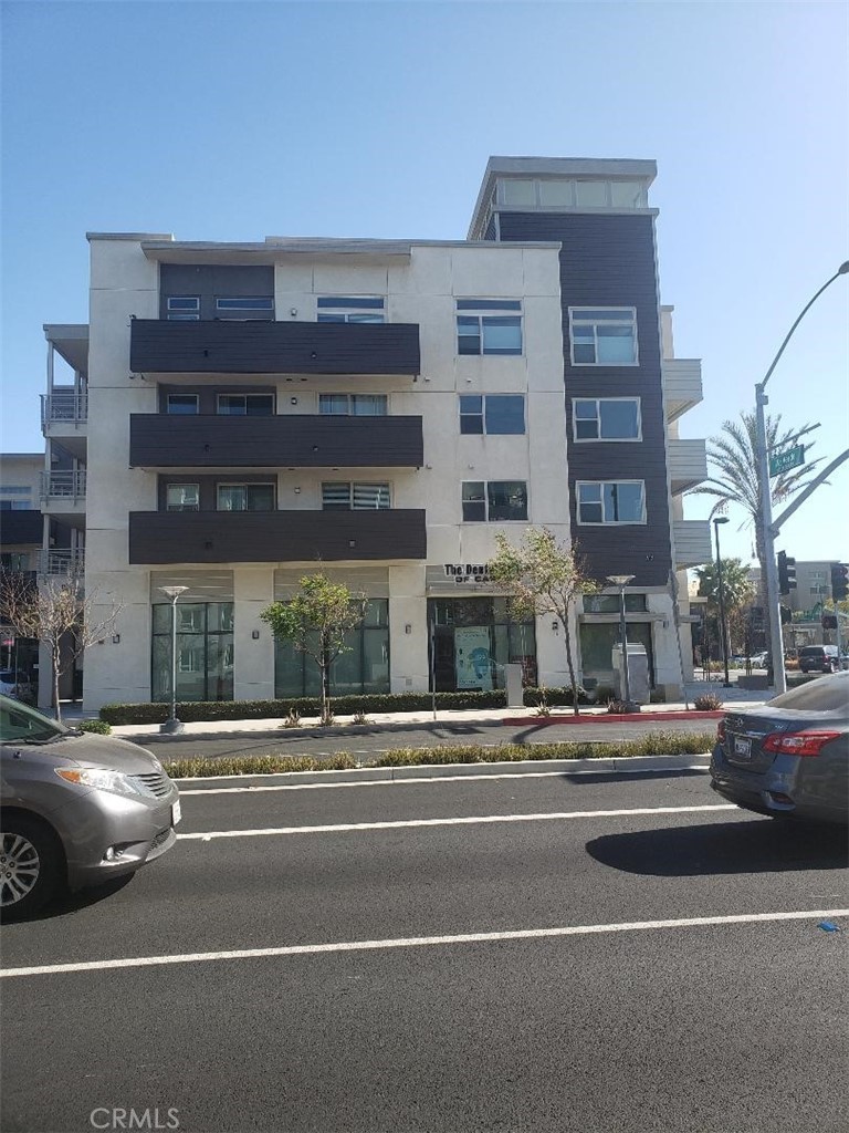 612 East Carson Street, Unit 202 Carson, CA 90745 - Photo 19 of 24 a view of a building and a cars parked on the side