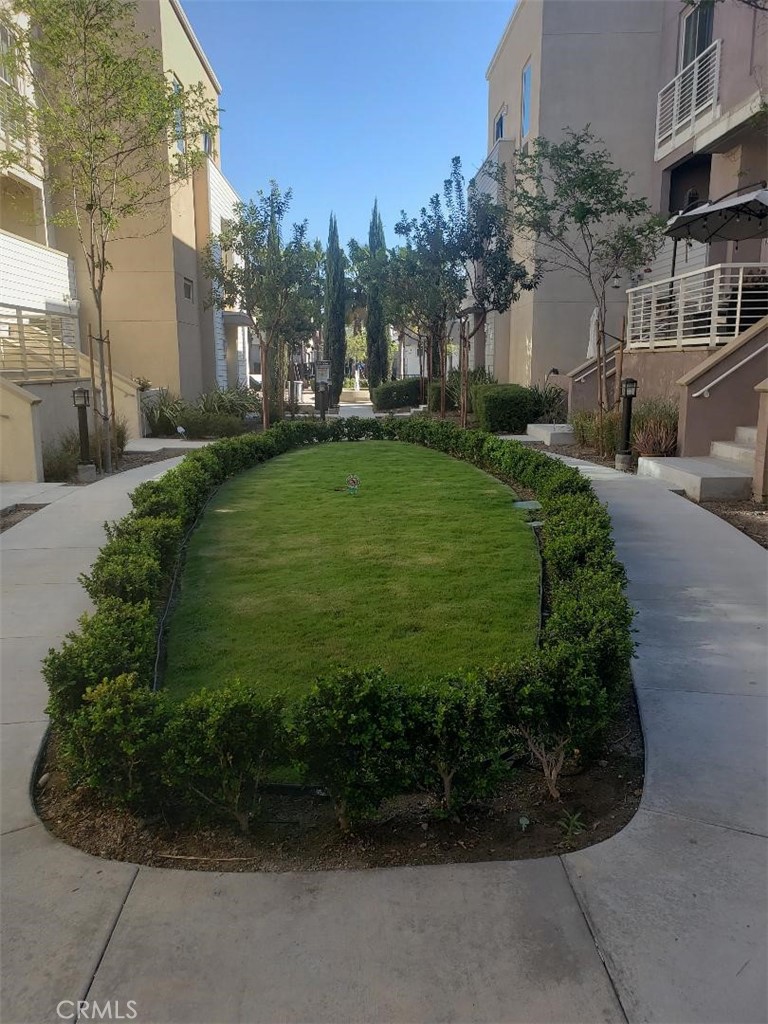 612 East Carson Street, Unit 202 Carson, CA 90745 - Photo 21 of 24 a view of a garden with a building