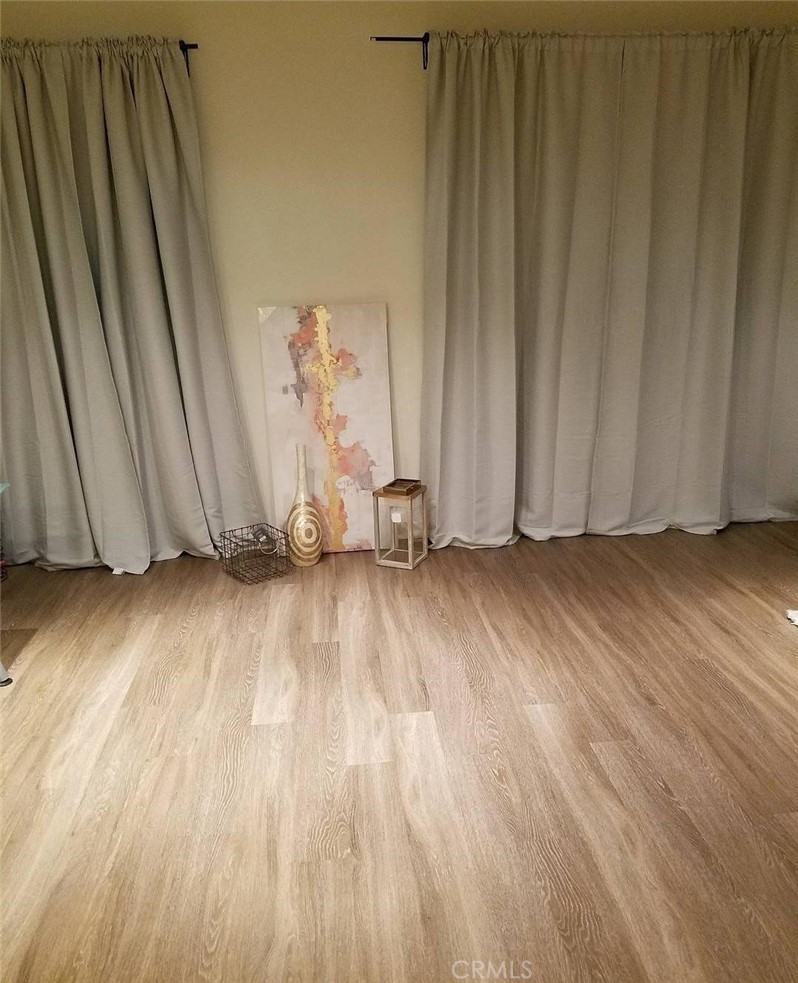 612 East Carson Street, Unit 202 Carson, CA 90745 - Photo 3 of 24 a view of wooden floor and brick walls