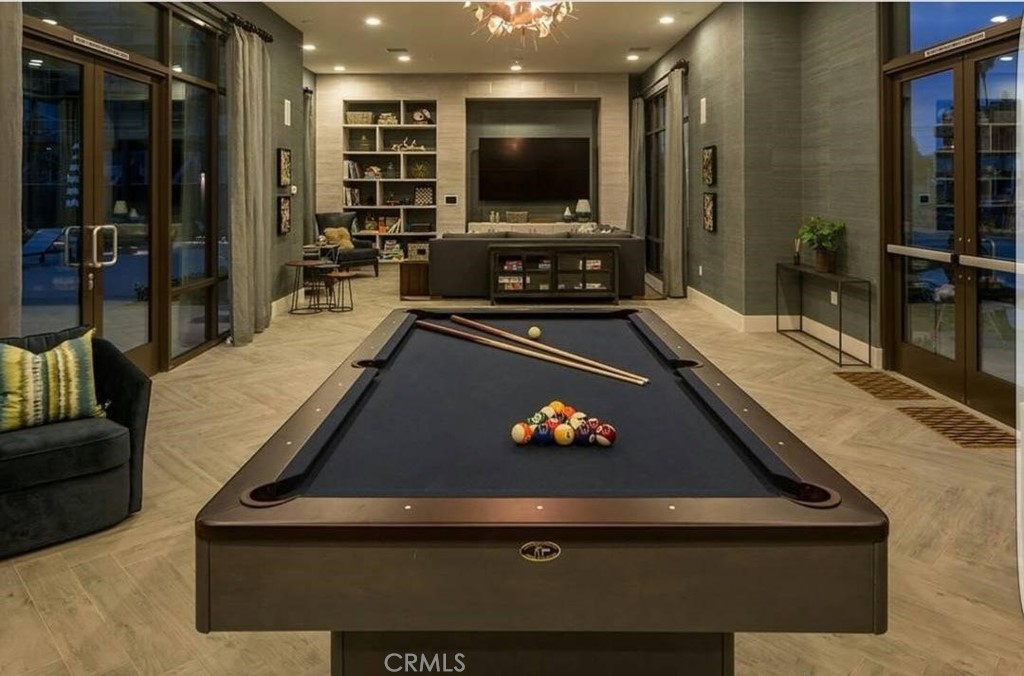 612 East Carson Street, Unit 202 Carson, CA 90745 - Photo 8 of 24 a room with furniture pool table flat screen tv and windows