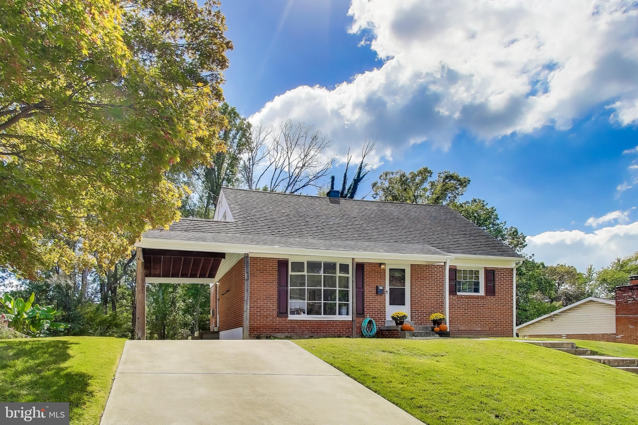 2107 Patrick Street Woodbridge, VA 22191 - Photo 2 of 28 a front view of a house with yard and green space