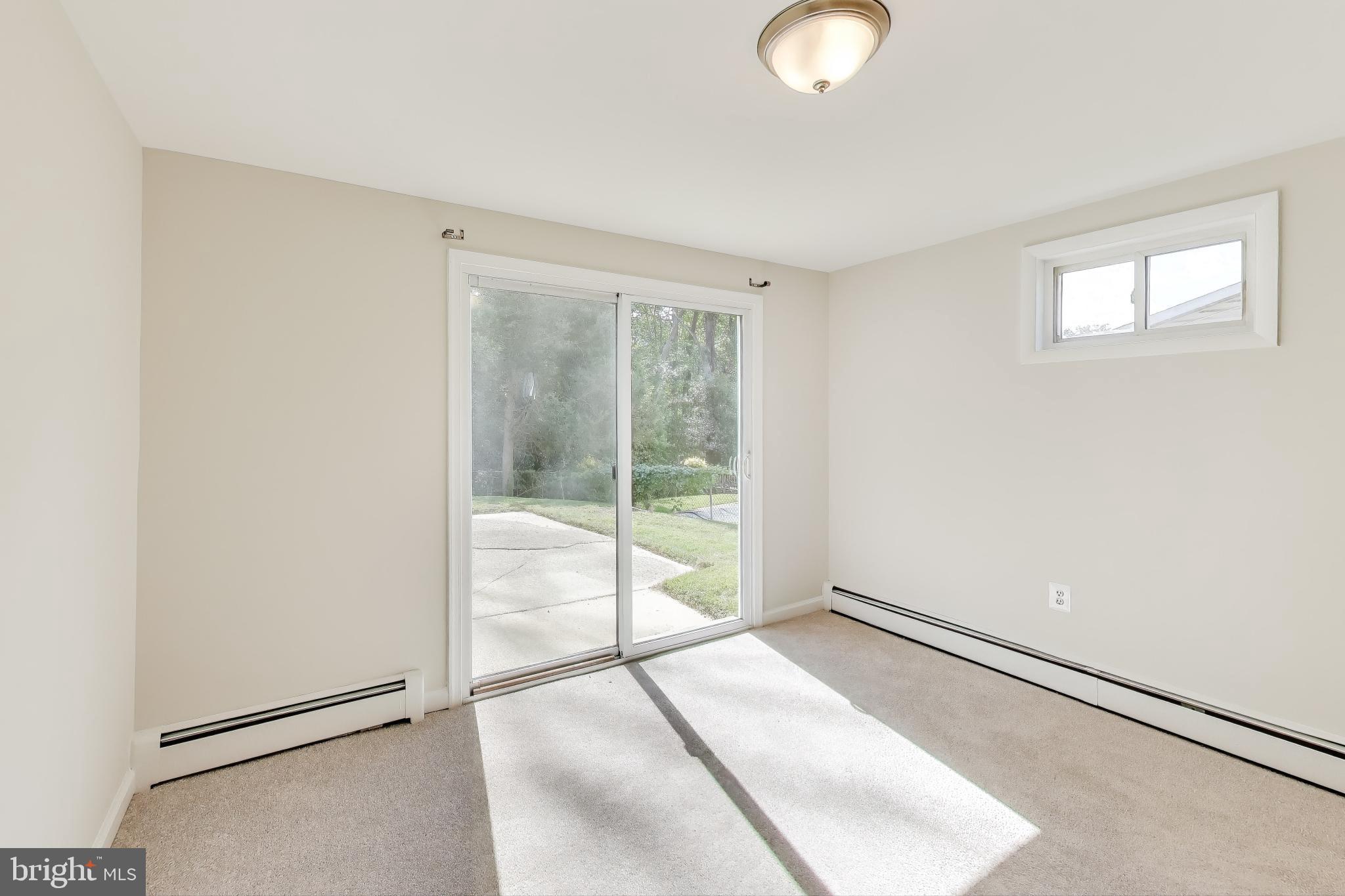 2107 Patrick Street Woodbridge, VA 22191 - Photo 21 of 28 a view of a room with wooden floor and windows