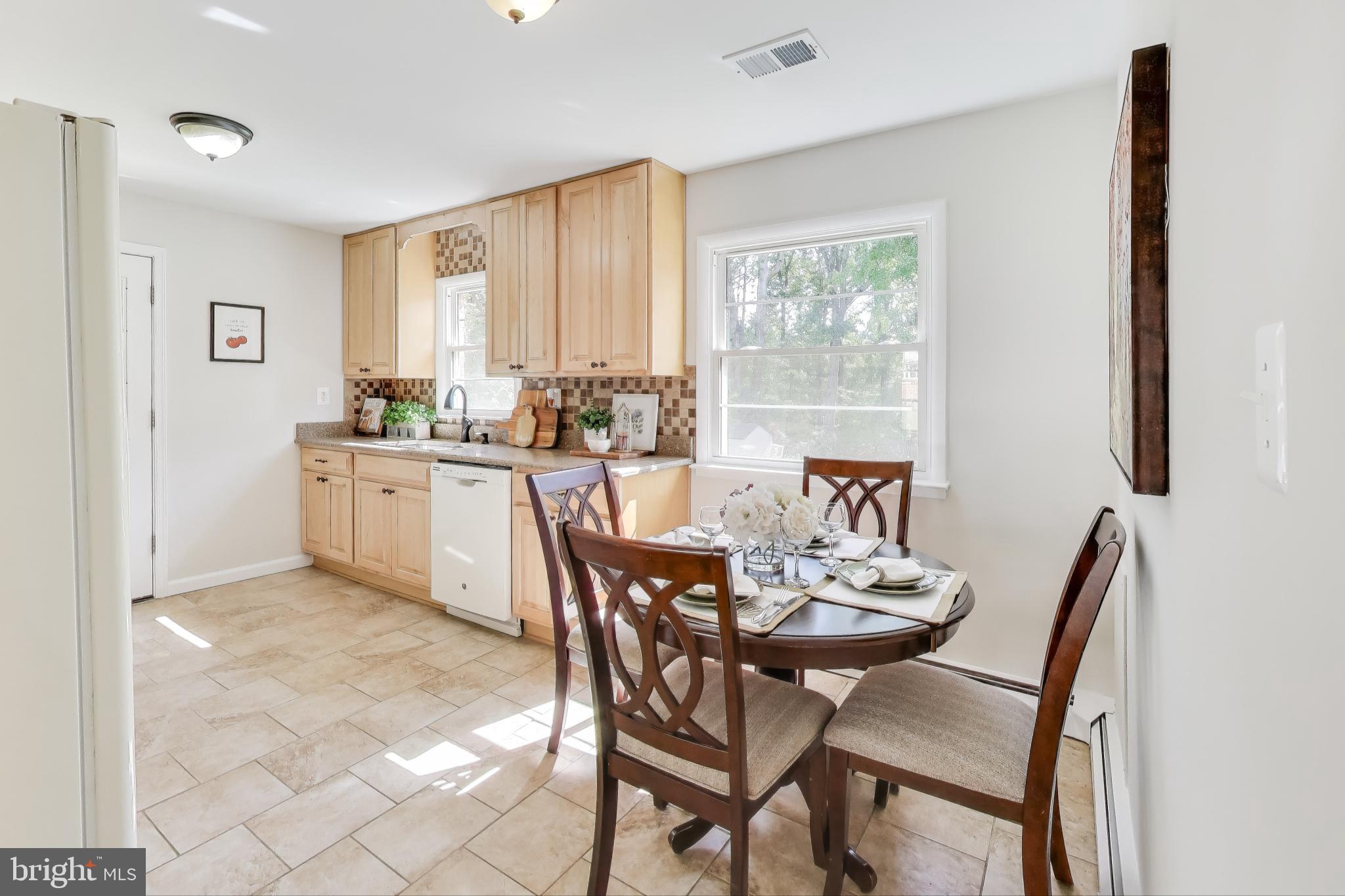 2107 Patrick Street Woodbridge, VA 22191 - Photo 5 of 28 a view of a dining room with furniture and a window