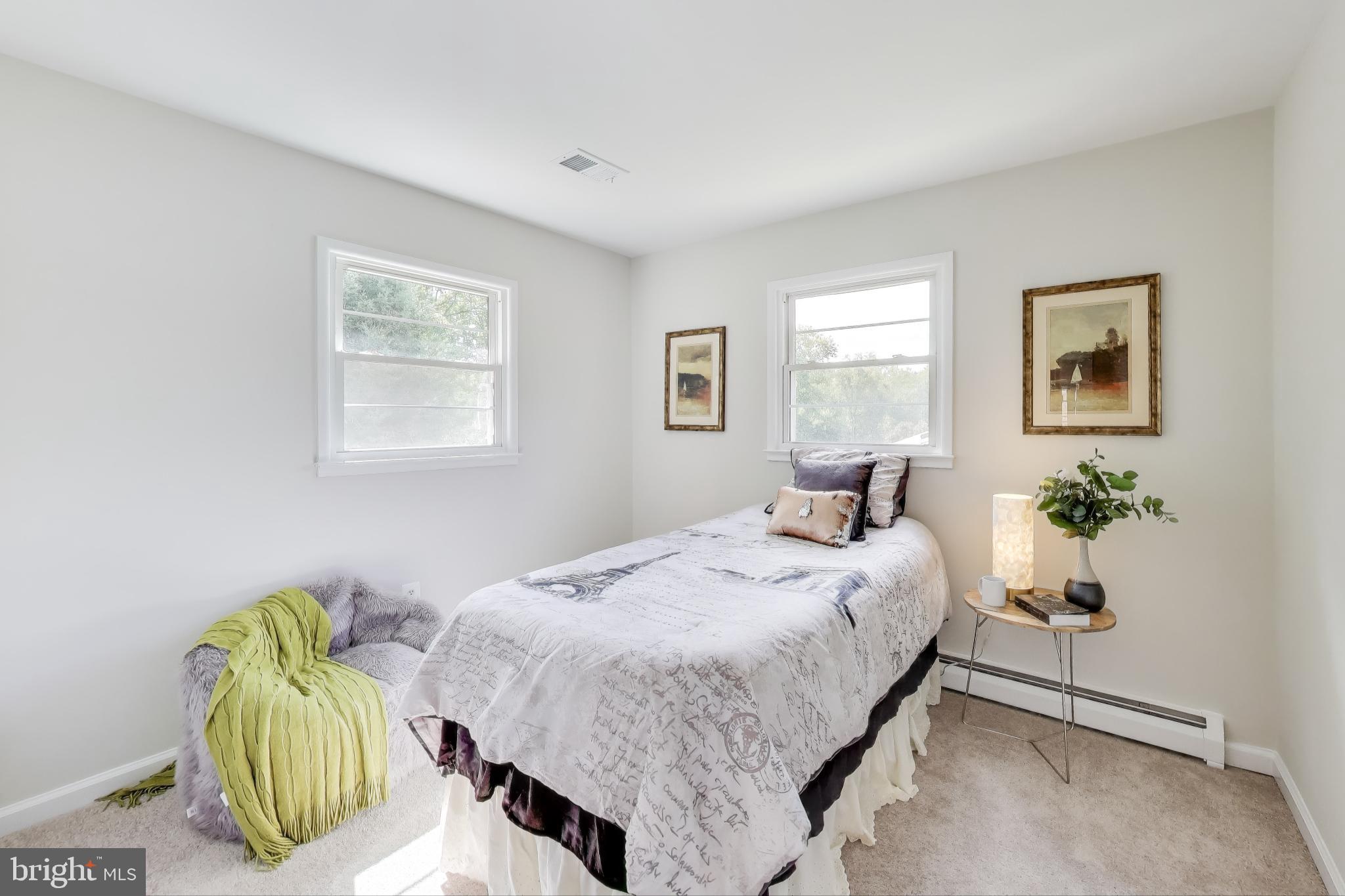 2107 Patrick Street Woodbridge, VA 22191 - Photo 10 of 28 a bedroom with a bed and painting on the wall
