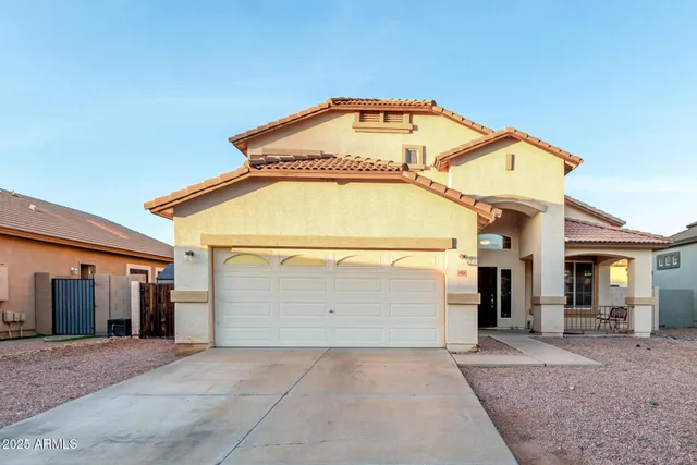 a view of a house with a garage