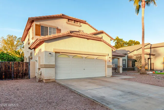a front view of a house with a garage