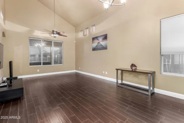 a view of room with hardwood floor and window