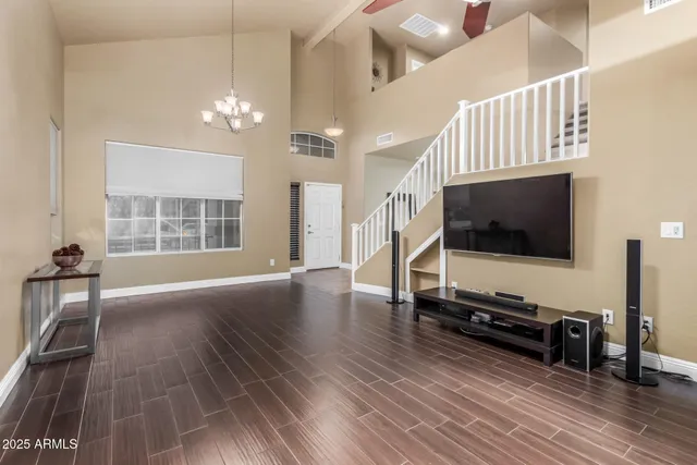 a kitchen with stainless steel appliances granite countertop a stove refrigerator and sink