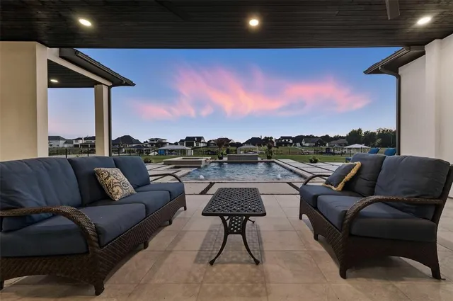 a terrace with outdoor seating and city view