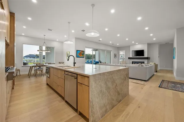 a large kitchen with stainless steel appliances lots of counter top space