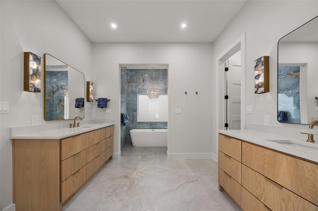 1532 Laguna Bay West Azle, TX 76020 - Photo 18 of 40 a bathroom with a double vanity sink mirror and bathtub