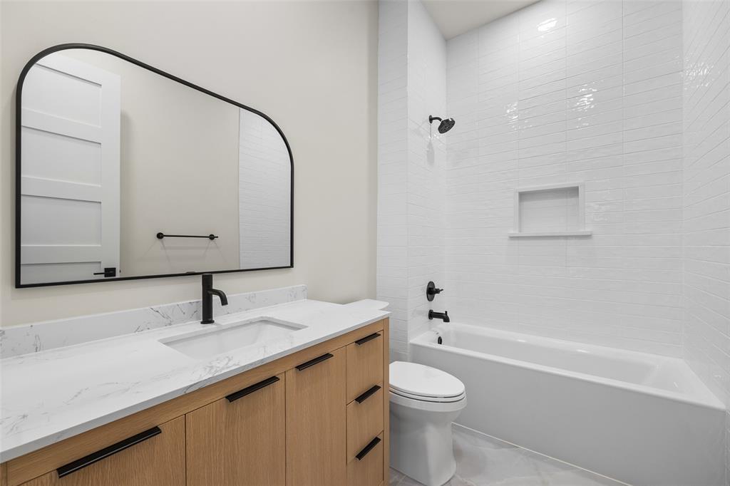 1532 Laguna Bay West Azle, TX 76020 - Photo 24 of 40 a bathroom with a sink a toilet and shower