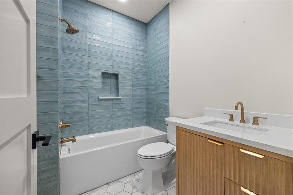 1532 Laguna Bay West Azle, TX 76020 - Photo 28 of 40 a bathroom with a granite countertop bathtub shower sink vanity and toilet