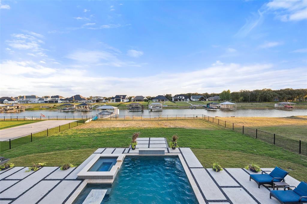 1532 Laguna Bay West Azle, TX 76020 - Photo 33 of 40 a view of a lake with a big yard