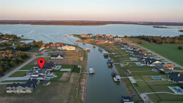 an aerial view of a houses with ocean view