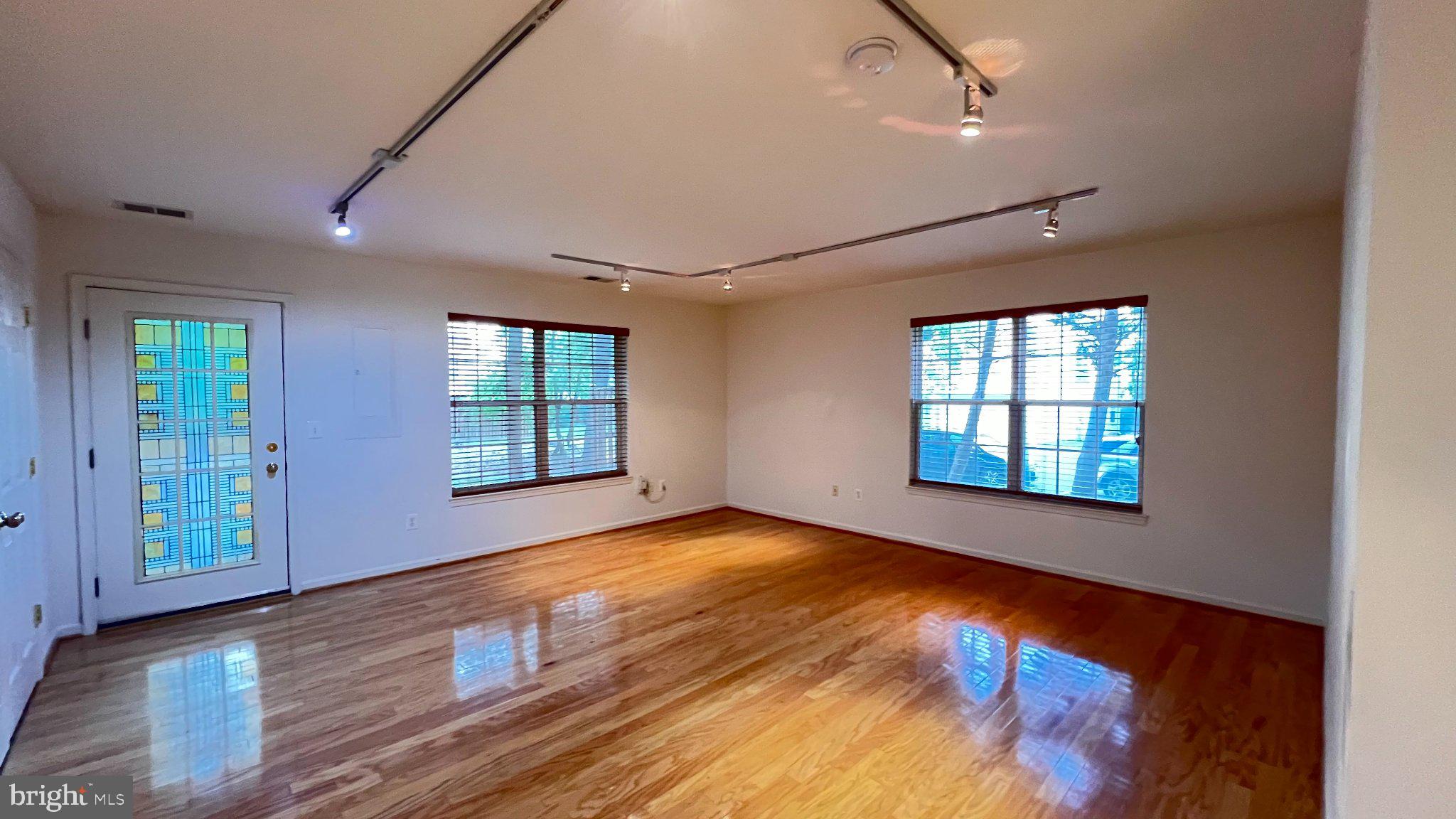 4100 Flower Fairfax, VA 22030 - Photo 35 of 47 a view of an empty room with wooden floor and a window