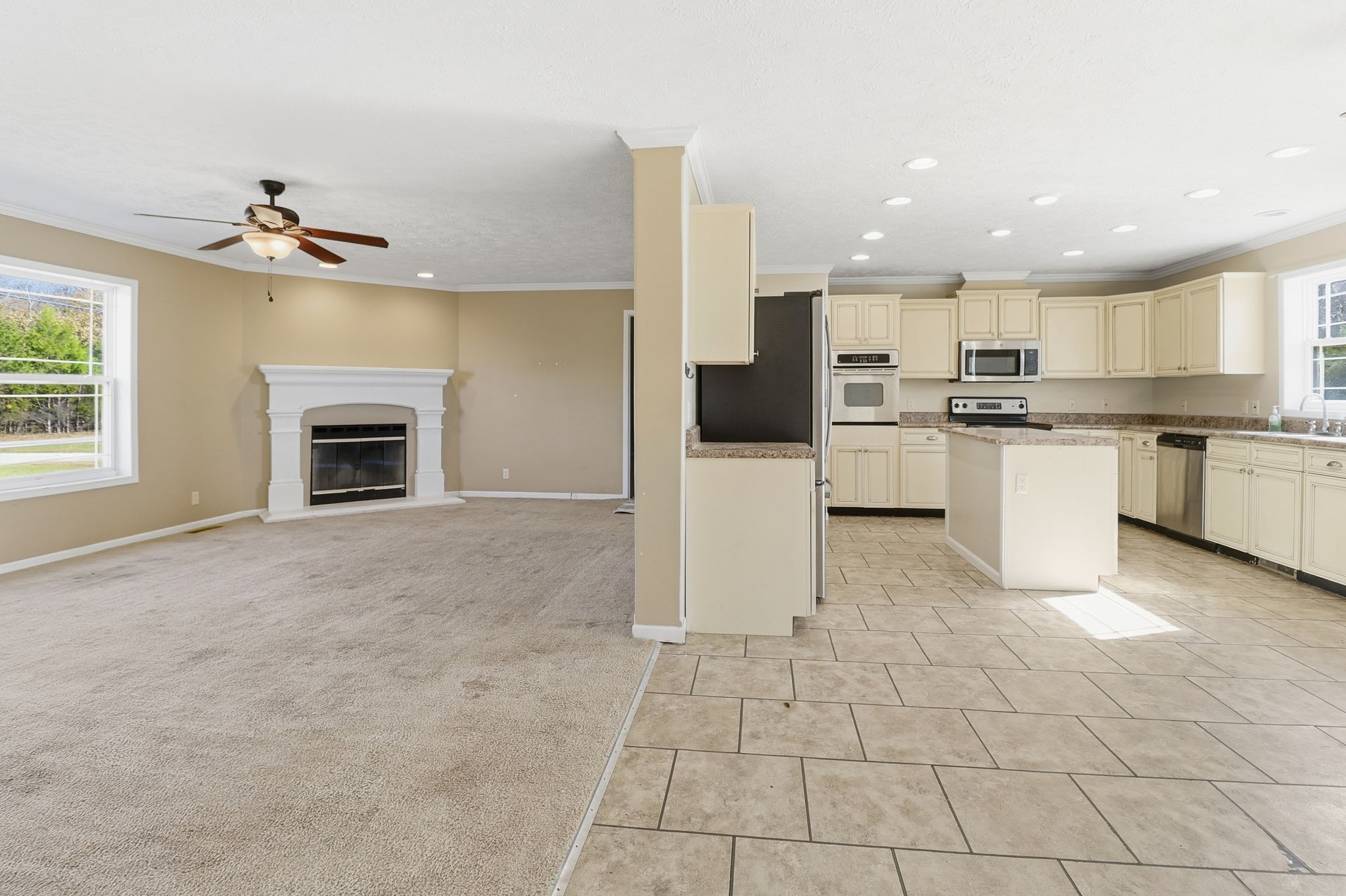 166 Carlton Road Chapel Hill, TN 37034 - Photo 11 of 27 a open kitchen view with fireplace cabinets and a window
