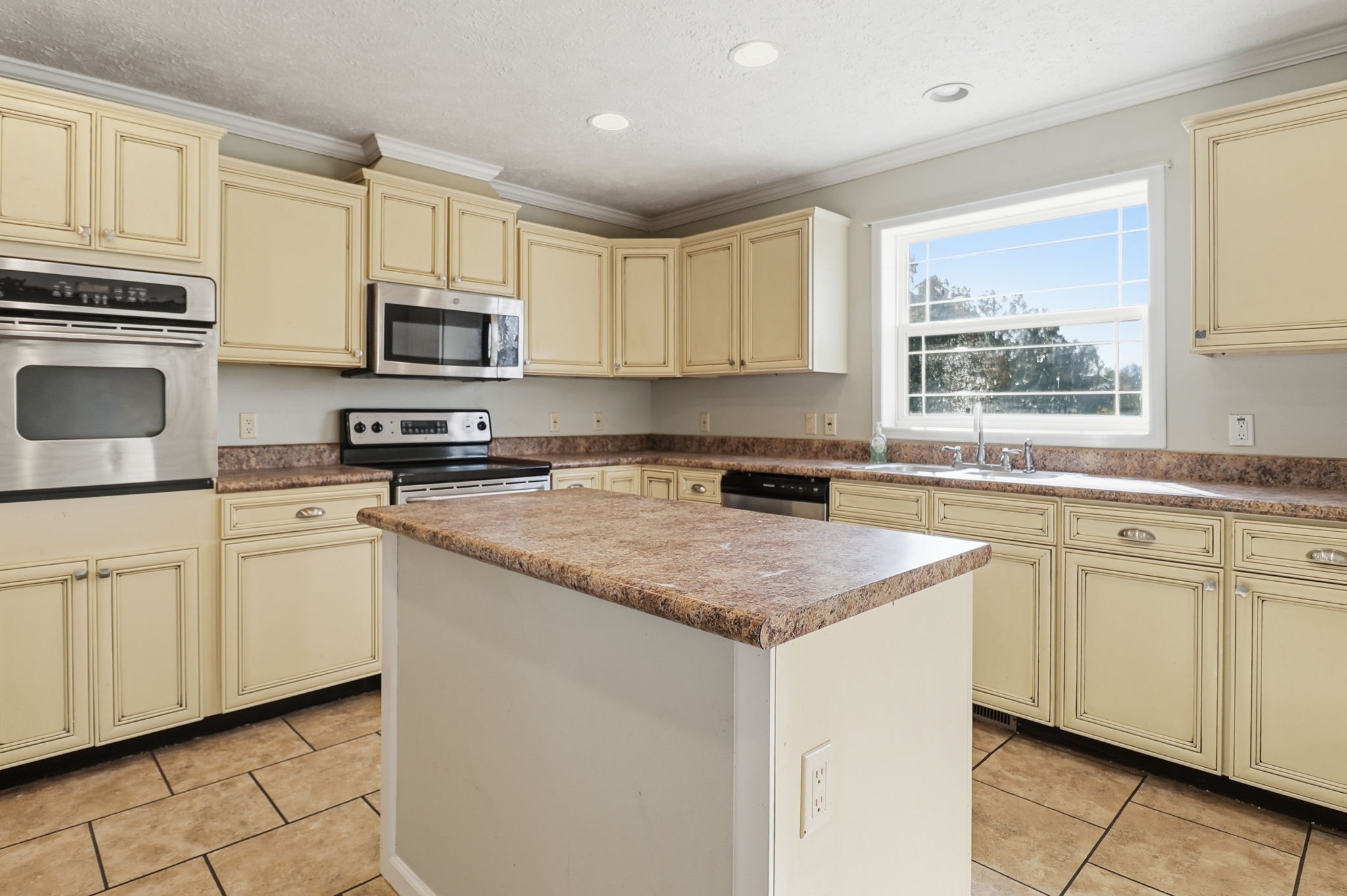 166 Carlton Road Chapel Hill, TN 37034 - Photo 13 of 27 a kitchen with cabinets appliances a sink and a window