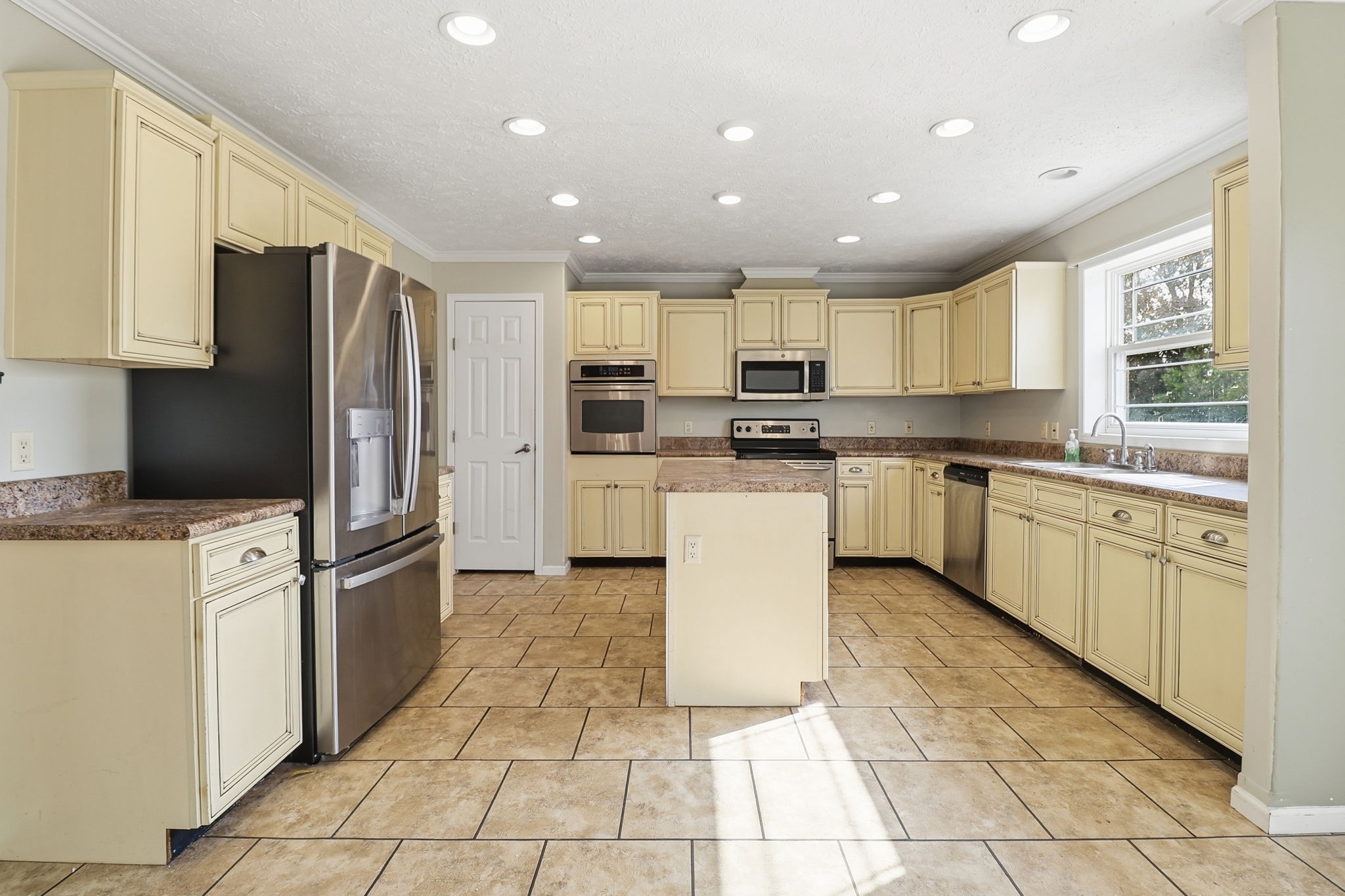 166 Carlton Road Chapel Hill, TN 37034 - Photo 14 of 27 a kitchen with stainless steel appliances granite countertop a stove top oven a sink a microwave and a refrigerator