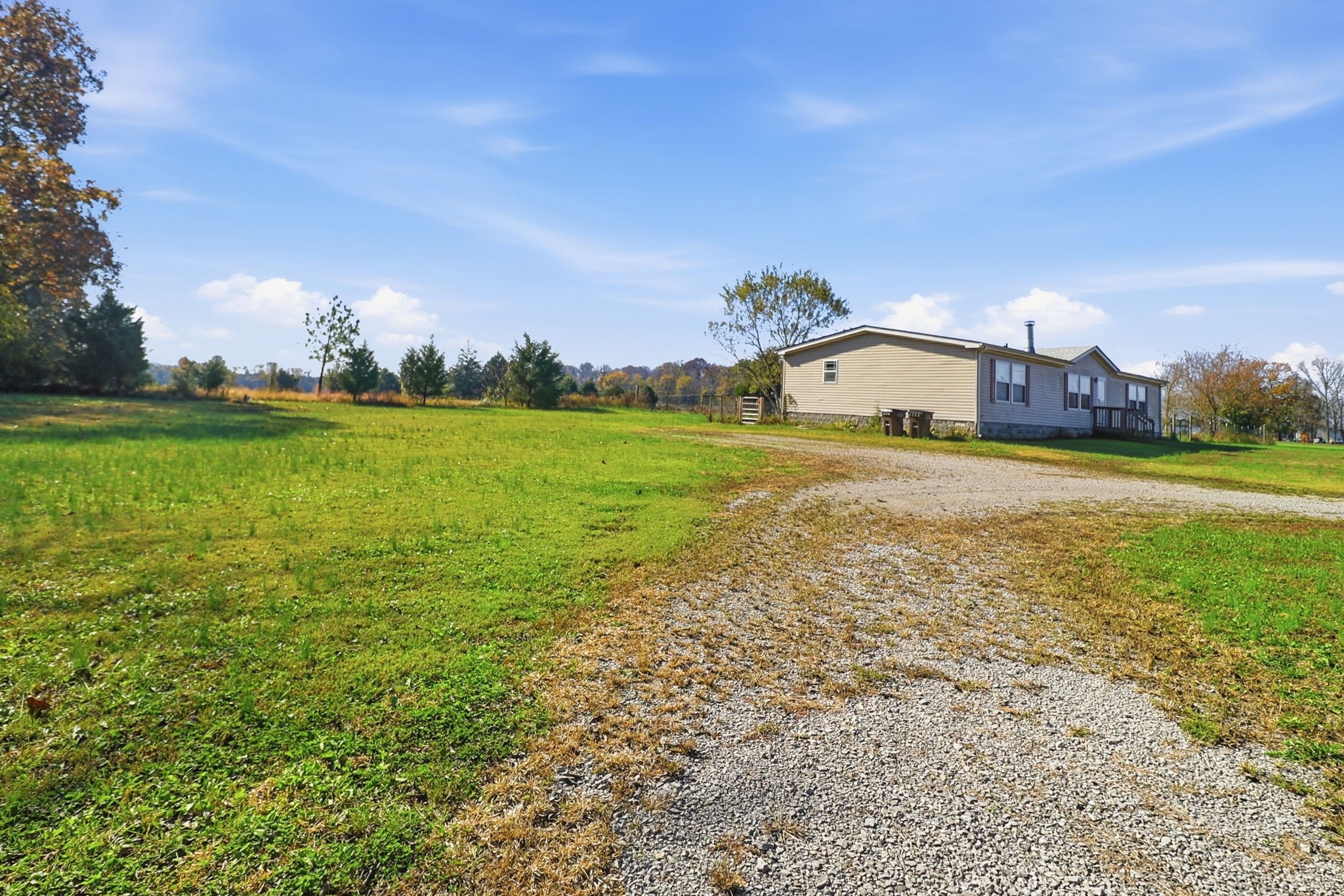 166 Carlton Road Chapel Hill, TN 37034 - Photo 2 of 27 a view of a big yard with a house in the background