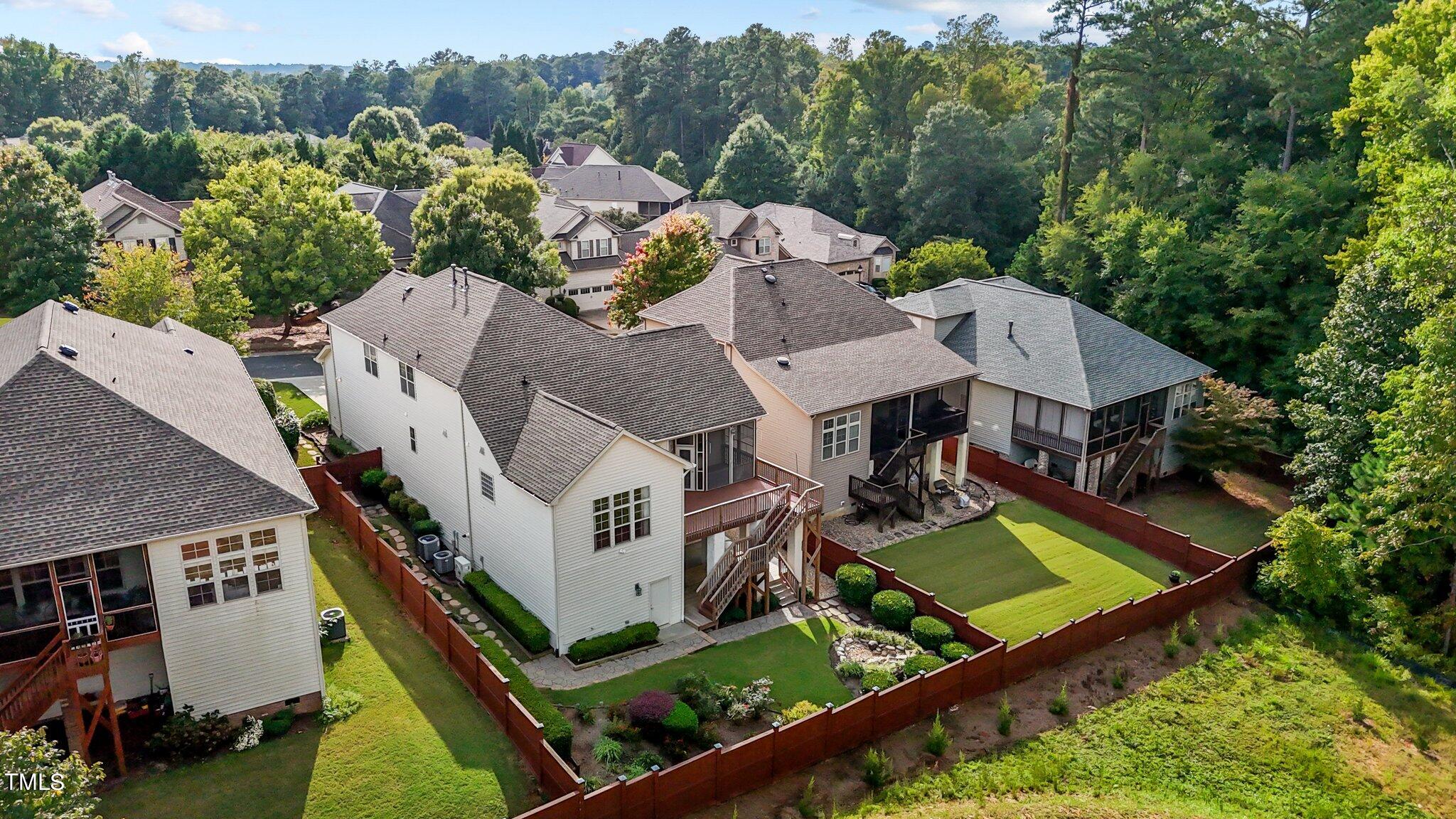 6112 Blakeman Lane Raleigh, NC 27617 - Photo 47 of 56 an aerial view of a house with pool trees and backyard
